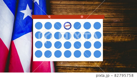 Composition of token template card and voting text over american flag 82795758