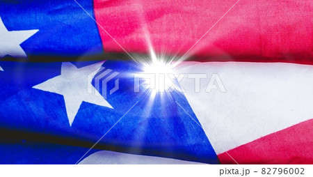 Bright spot of light against american flag Bright spot of light against american flag 82796002