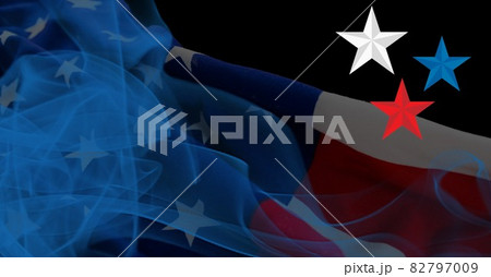 Composition of blue, red and white star with blue smoke and american flag on black background 82797009