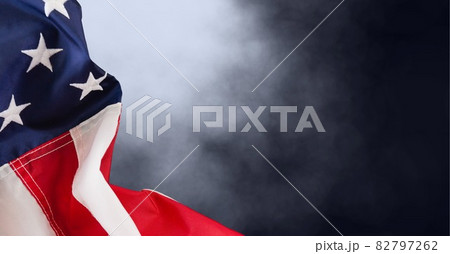Composition of american flag and smoke on black background 82797262