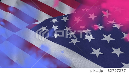 Composition of american flag and colourful pink flare smoke 82797277