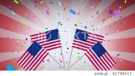 Composition of american flags, over falling confetti, on red and white stripes 82798417