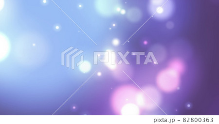 Image of glowing white spots of light moving in hypnotic motion on purple background 82800363
