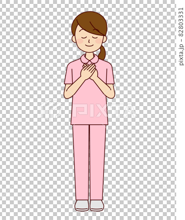 Female nurse putting her hand on her chest Female nurse putting her hand on her chest 82803331