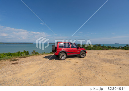 3 March 2021 Red 4x4 Red car Suzuki Vitara 1993 on the High mountain view Beautiful sea view at sunrise in Phuket Thailand 82804014