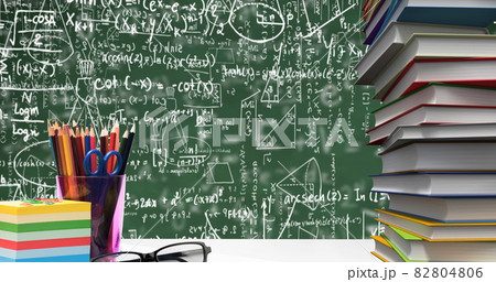 School stationary items and glasses against mathematical equations floating on green background School stationary items and glasses against mathematical equations floating on green background 82804806