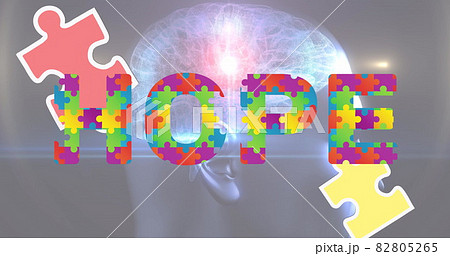 Image of hope text formed with puzzles over glowing human brain on grey background 82805265