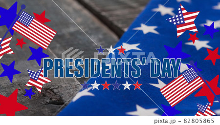 Image of happy presidents' day text with american flags, stars and stripes, on wood 82805865