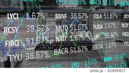 Digital composite image of stock market data processing against laptop on office desk Digital composite image of stock market data processing against laptop on office desk 82806827