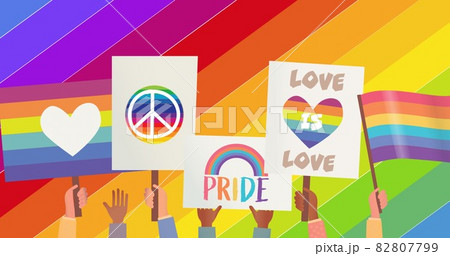 People holding lqbtq signs over rainbow stripes 82807799