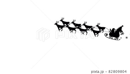 Digital image of black silhouette of santa claus and christmas tree in sleigh being pulled by re 82809804