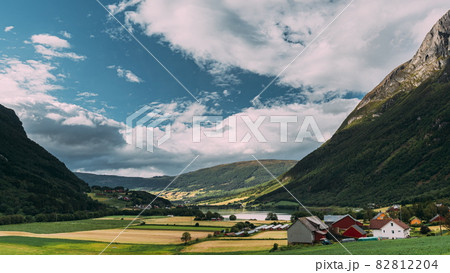 Byrkjelo Village, Sogn Og Fjordane County, Norway. Beautiful Sky Above Norwegian Rural Landscape. Bergheimsvatnet Lake In Summer Day. Agricultural And Weather Forecast Concept. Time-lapse 4k Byrkjelo Village, Sogn Og Fjordane County, Norway. Beautiful Sky Above Norwegian Rural Landscape. Bergheimsvatnet Lake In Summer Day. Agricultural And Weather Forecast Concept. Time-lapse 4k 82812204