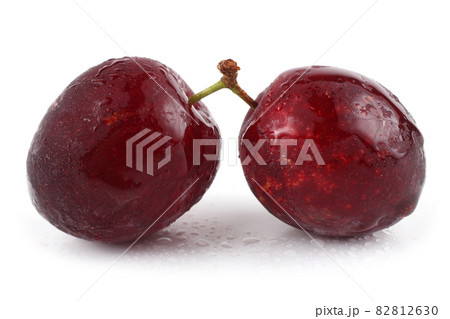 Red plums isolated on white 82812630