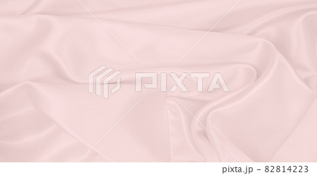 Smooth elegant pink silk or satin texture as wedding background. Luxurious background design Smooth elegant pink silk or satin texture as wedding background. Luxurious background design 82814223