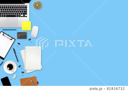 flat lay workspace table with laptop computer, office supplies, coffee cup, tablet and cell phone on blue pastel background flat lay workspace table with laptop computer, office supplies, coffee cup, tablet and cell phone on blue pastel background 82816732