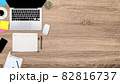 flat lay workspace table with laptop computer, office supplies, coffee cup, tablet and cell phone on wooden background 82816737