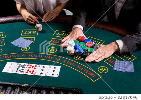 couple playing poker at the table couple playing poker at the table 82817046