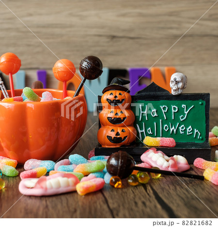 Happy Halloween day with ghost candies, pumpkin bowl, Jack O lantern and decorative (selective focus). Trick or Threat, Hello October, fall autumn, Festive, party and holiday concept Happy Halloween day with ghost candies, pumpkin bowl, Jack O lantern and decorative (selective focus). Trick or Threat, Hello October, fall autumn, Festive, party and holiday concept 82821682
