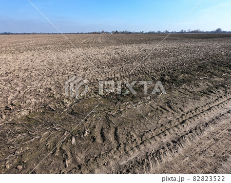 Clear blue sky over a plowed field. Landscape. 82823522