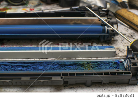 view of colored toner in the hopper of the blue laser printer cartridge view of colored toner in the hopper of the blue laser printer cartridge 82823631