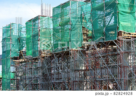JOHOR, MALAYSIA -APRIL 13, 2016: Scaffolding used as the temporary structure to support platform, form work and structure at the construction site. Also used it as a walking platform for workers.  82824928