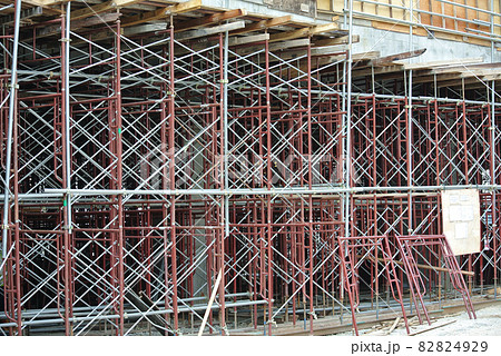 JOHOR, MALAYSIA -APRIL 13, 2016: Scaffolding used as the temporary structure to support platform, form work and structure at the construction site. Also used it as a walking platform for workers.  82824929