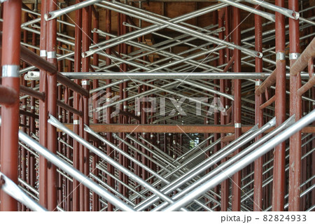 JOHOR, MALAYSIA -APRIL 13, 2016: Scaffolding used as the temporary structure to support platform, form work and structure at the construction site. Also used it as a walking platform for workers.  82824933