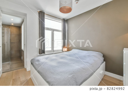 Interior of a cozy and bright bedroom with beautiful decoration Interior of a cozy and bright bedroom with beautiful decoration 82824992