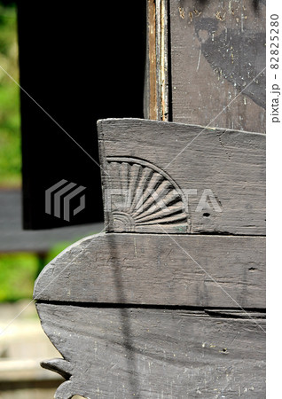 WEST SUMATERA, INDONESIA -JUNE 8, 2014: Architectural detail and wood craft at Tuo Kayu Jao Mosque in West Sumatra, Indonesia. Built in 1599 and is the second oldest mosque in Indonesia. 82825280