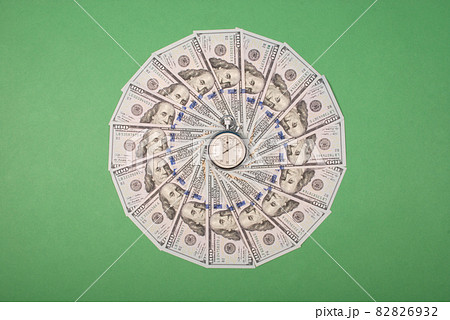 Stopwatch on mandala kaleidoscope from money. Stopwatch on mandala kaleidoscope from money. 82826932