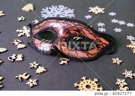 Carnival mask and New Year decor on dark background Carnival mask and New Year decor on dark background 82827277