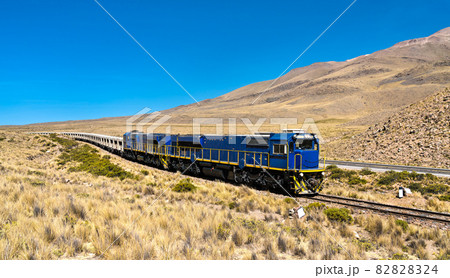 Freight train at high altitude in the Andes in Peru 82828324
