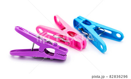 Colorful plastic clothespins or clothes pegs isolated on white background 82836296