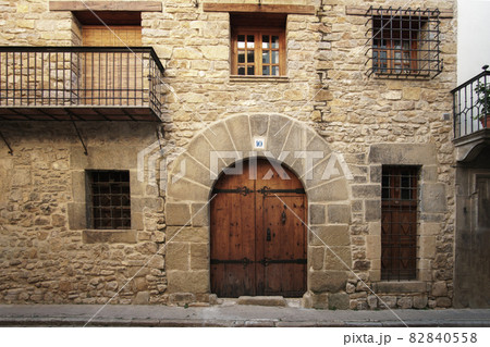 traditional stone facade of a 2-storey house 16th century architecture, Rubielos de Mora 82840558