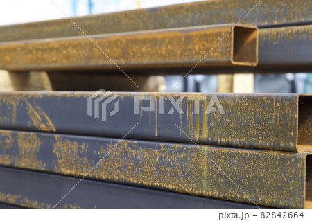 Metal profile pipe of rectangular cross section in packs at the warehouse of metal products Metal profile pipe of rectangular cross section in packs at the warehouse of metal products 82842664