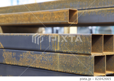 Metal profile pipe of rectangular cross section in packs at the warehouse of metal products Metal profile pipe of rectangular cross section in packs at the warehouse of metal products 82842665