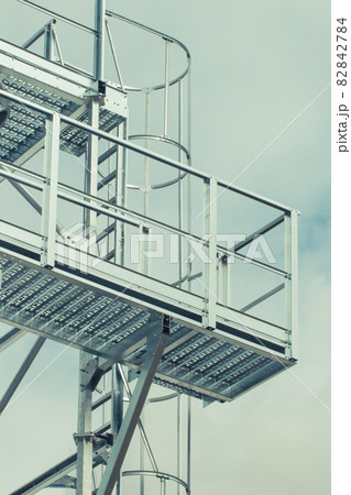 Ladder on silo for storage grain after harvest. Detail of agricultural equipments 82842784