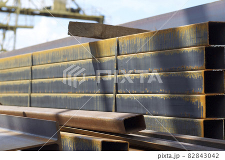 Metal profile pipe of rectangular cross section in packs at the warehouse of metal products Metal profile pipe of rectangular cross section in packs at the warehouse of metal products 82843042