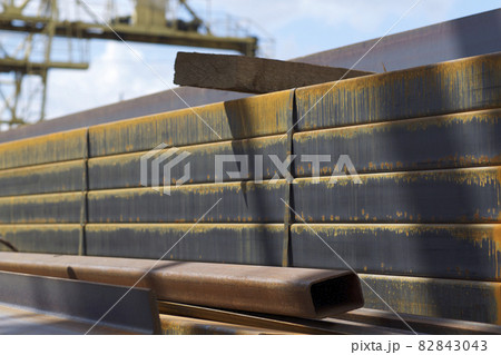 Metal profile pipe of rectangular cross section in packs at the warehouse of metal products Metal profile pipe of rectangular cross section in packs at the warehouse of metal products 82843043