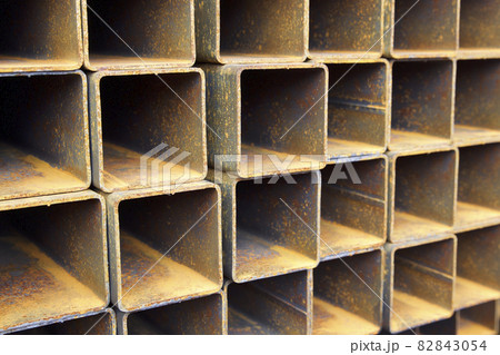 Metal profile pipe of rectangular cross section in packs at the warehouse of metal products Metal profile pipe of rectangular cross section in packs at the warehouse of metal products 82843054
