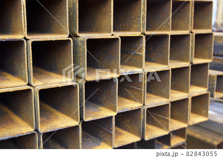 Metal profile pipe of rectangular cross section in packs at the warehouse of metal products Metal profile pipe of rectangular cross section in packs at the warehouse of metal products 82843055