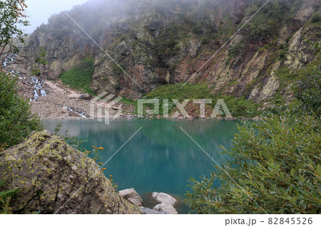 Panorama view of lake scene in mountains, national park of Dombay, Caucasus Panorama view of lake scene in mountains, national park of Dombay, Caucasus 82845526