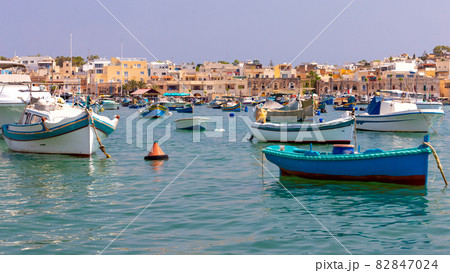 Marsaxlokk. Traditional boats Luzzu in the old harbor. Marsaxlokk. Traditional boats Luzzu in the old harbor. 82847024
