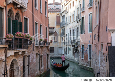 Panoramic view of Venice canal with historical buildings and gondolas Panoramic view of Venice canal with historical buildings and gondolas 82847026