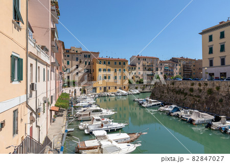 Panoramic view of historic buildings of Lovorno with water canal 82847027