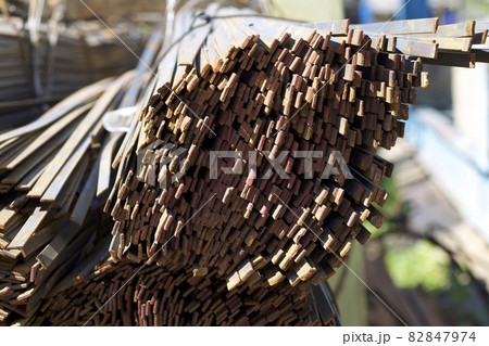 Metal profile strip in packs at the warehouse of metal products 82847974