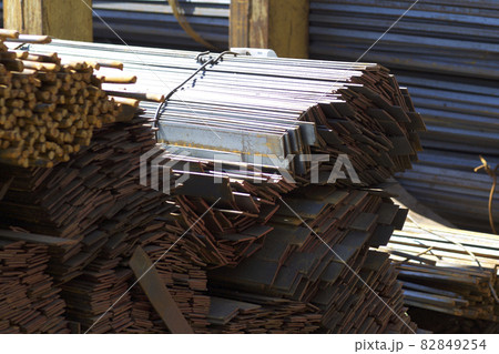 Metal profiles of different kinds are located in the metal products warehouse Metal profiles of different kinds are located in the metal products warehouse 82849254