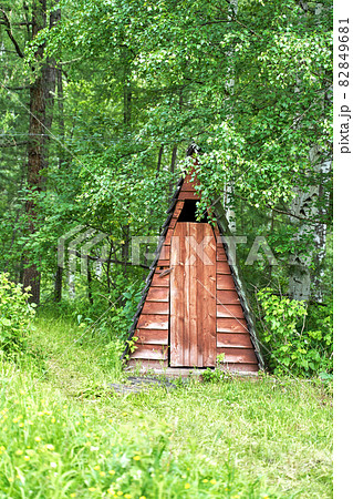 Wood house in forest. Local travel concept. Sustainable lifestyle. Summer Wood house in forest. Local travel concept. Sustainable lifestyle. Summer 82849681
