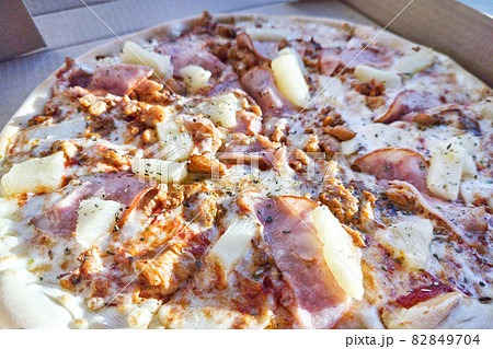 hawaiina pizza with pineapple. Beacon and cheese hawaiina pizza with pineapple. Beacon and cheese 82849704
