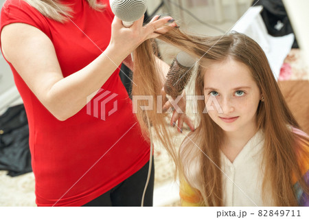 Mother dry daughter hair. Home activity. New normal. Barber equipment Mother dry daughter hair. Home activity. New normal. Barber equipment 82849711